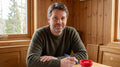 files/Man_seated_at_table_202608262208.jpg